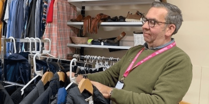 Keith sorting clothes in our Kemptown charity shop