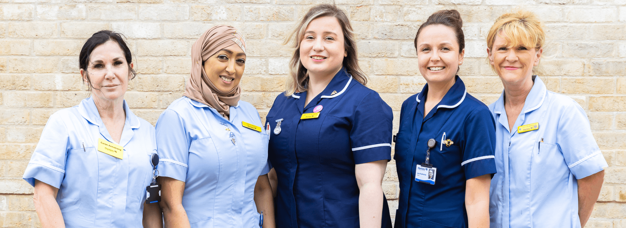 A group of nurses and healthcare assistants walking together
