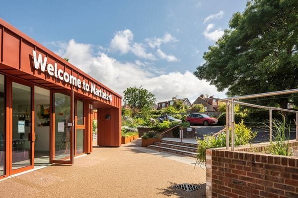 Front of the hospice with Welcome to Martlets sign