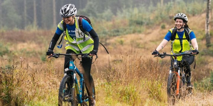 two people riding mountain bikes in the lake district