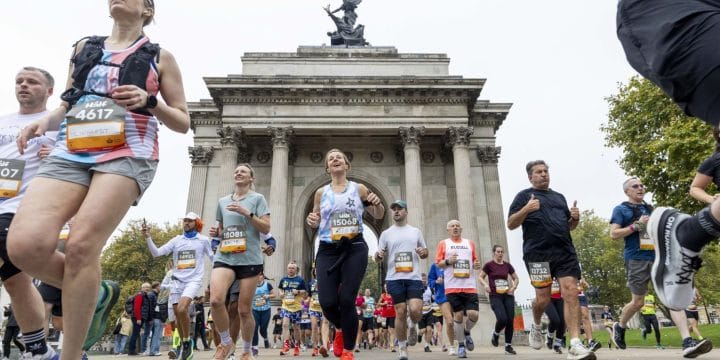 runners passing in front of a monument in one of London's Royal Parks in the London Royal Parks Half Marathon